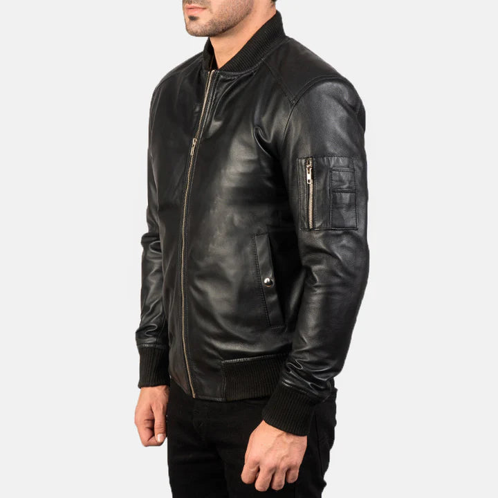 "Bomia MA-1 Black Leather Bomber Jacket by MordenJacket – a sleek reinterpretation of the classic MA-1 bomber, crafted in smooth black leather with ribbed cuffs, utility pocket on the sleeve, and a timeless silhouette for everyday edge."
riht side pose