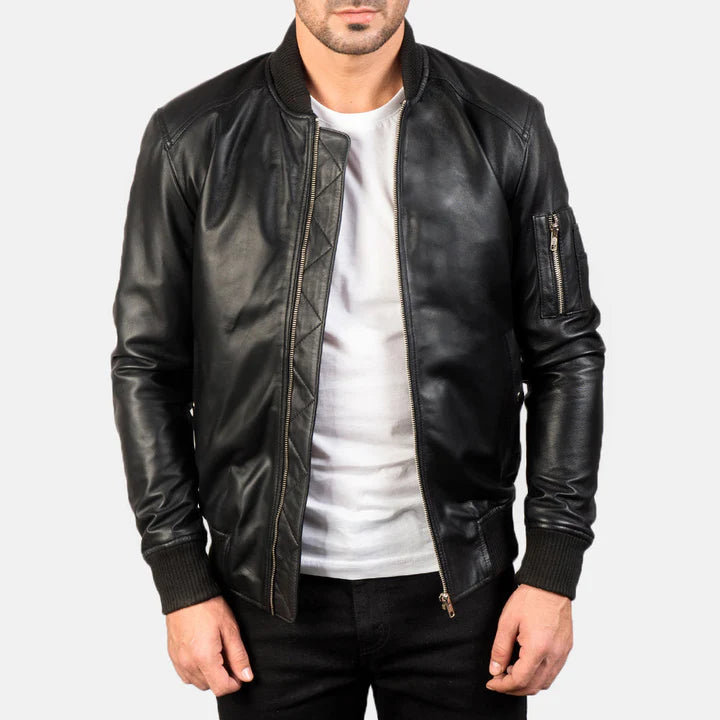 "Bomia MA-1 Black Leather Bomber Jacket by MordenJacket – a sleek reinterpretation of the classic MA-1 bomber, crafted in smooth black leather with ribbed cuffs, utility pocket on the sleeve, and a timeless silhouette for everyday edge."