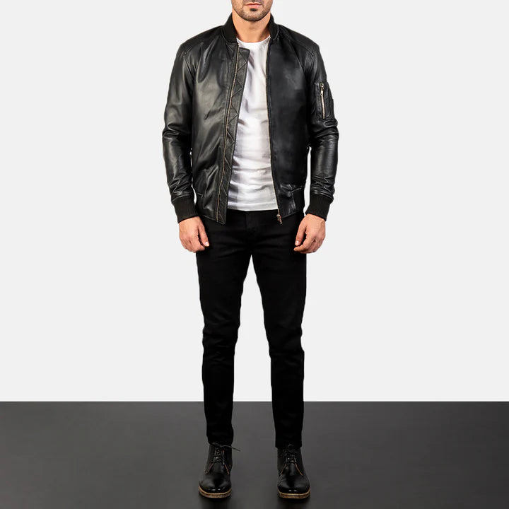 "Bomia MA-1 Black Leather Bomber Jacket by MordenJacket – a sleek reinterpretation of the classic MA-1 bomber, crafted in smooth black leather with ribbed cuffs, utility pocket on the sleeve, and a timeless silhouette for everyday edge."