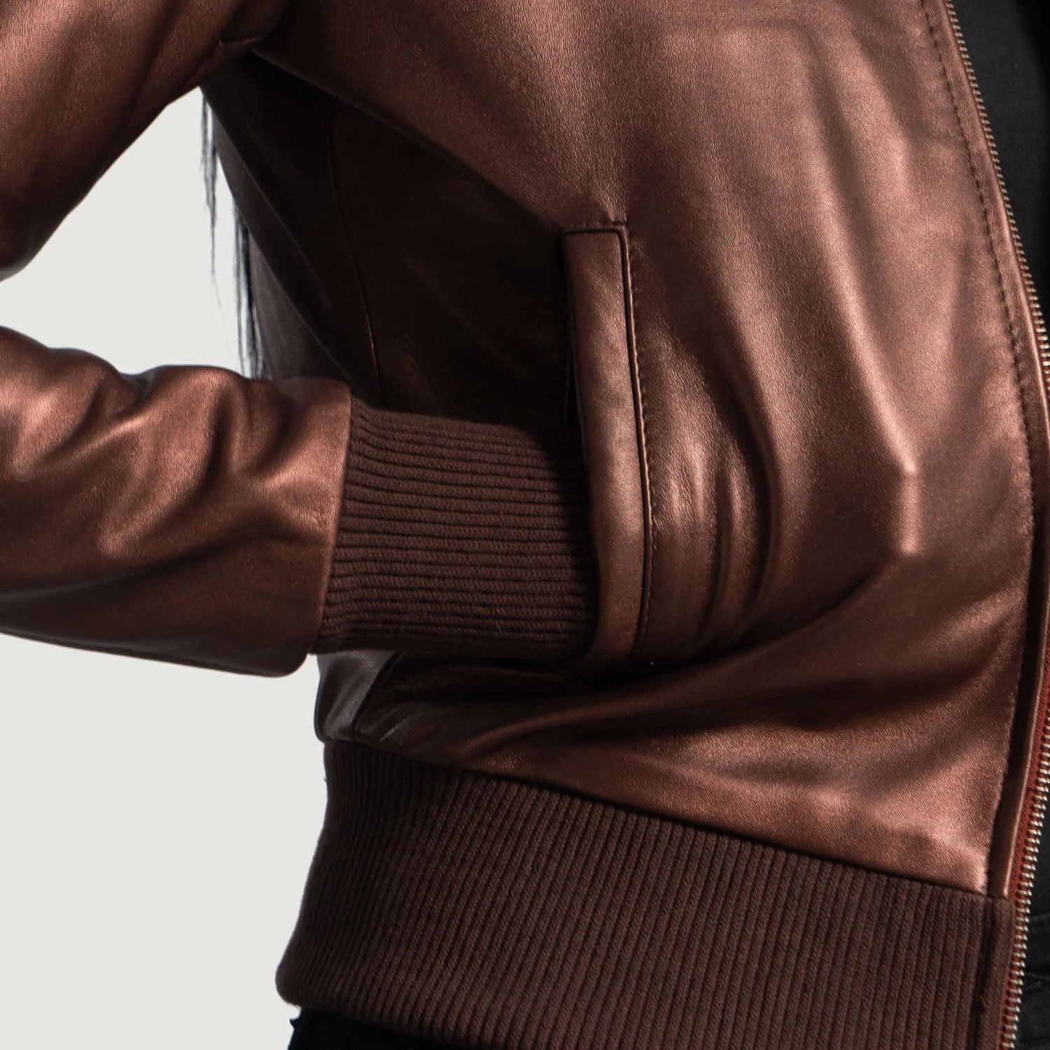 "Reida Maroon Leather Jacket by MordenJacket – a striking maroon leather jacket featuring a sleek silhouette, refined stitching, and modern hardware, offering a bold blend of elegance and edge for standout style."
zoom shot of pocket front side